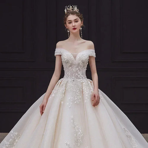 Luxury Off-Shoulder Wedding Dress - Handmade Lace Ball Gown | Femstylo