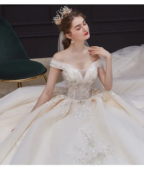 Luxury Off-Shoulder Wedding Dress - Handmade Lace Ball Gown | Femstylo