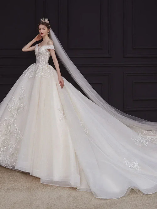 Luxury Off-Shoulder Wedding Dress - Handmade Lace Ball Gown | Femstylo
