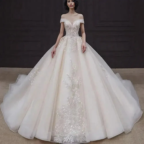 Luxury Off-Shoulder Wedding Dress - Handmade Lace Ball Gown | Femstylo