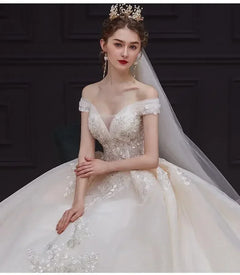 Luxury Off-Shoulder Wedding Dress - Handmade Lace Ball Gown | Femstylo