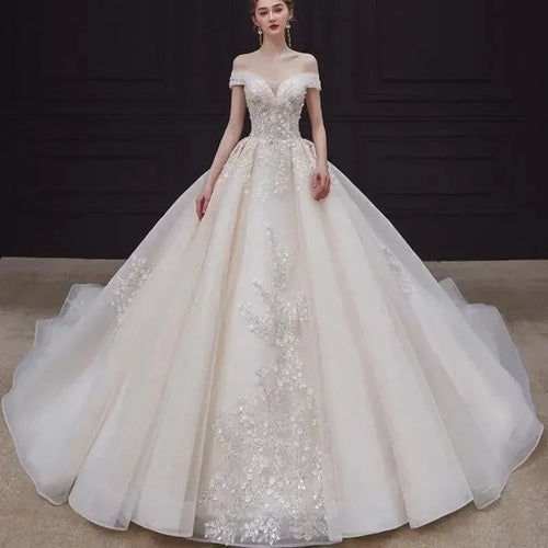 Luxury Off-Shoulder Wedding Dress - Handmade Lace Ball Gown | Femstylo