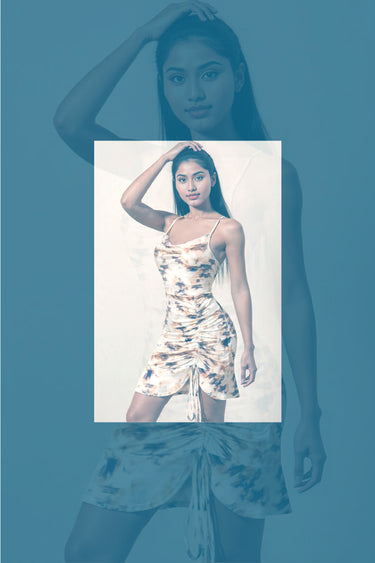 nekkidnow.com Woman wearing a floral dress with a blue overlay